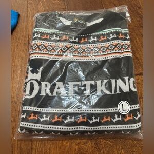 DraftKings sweater with black and orange pattern